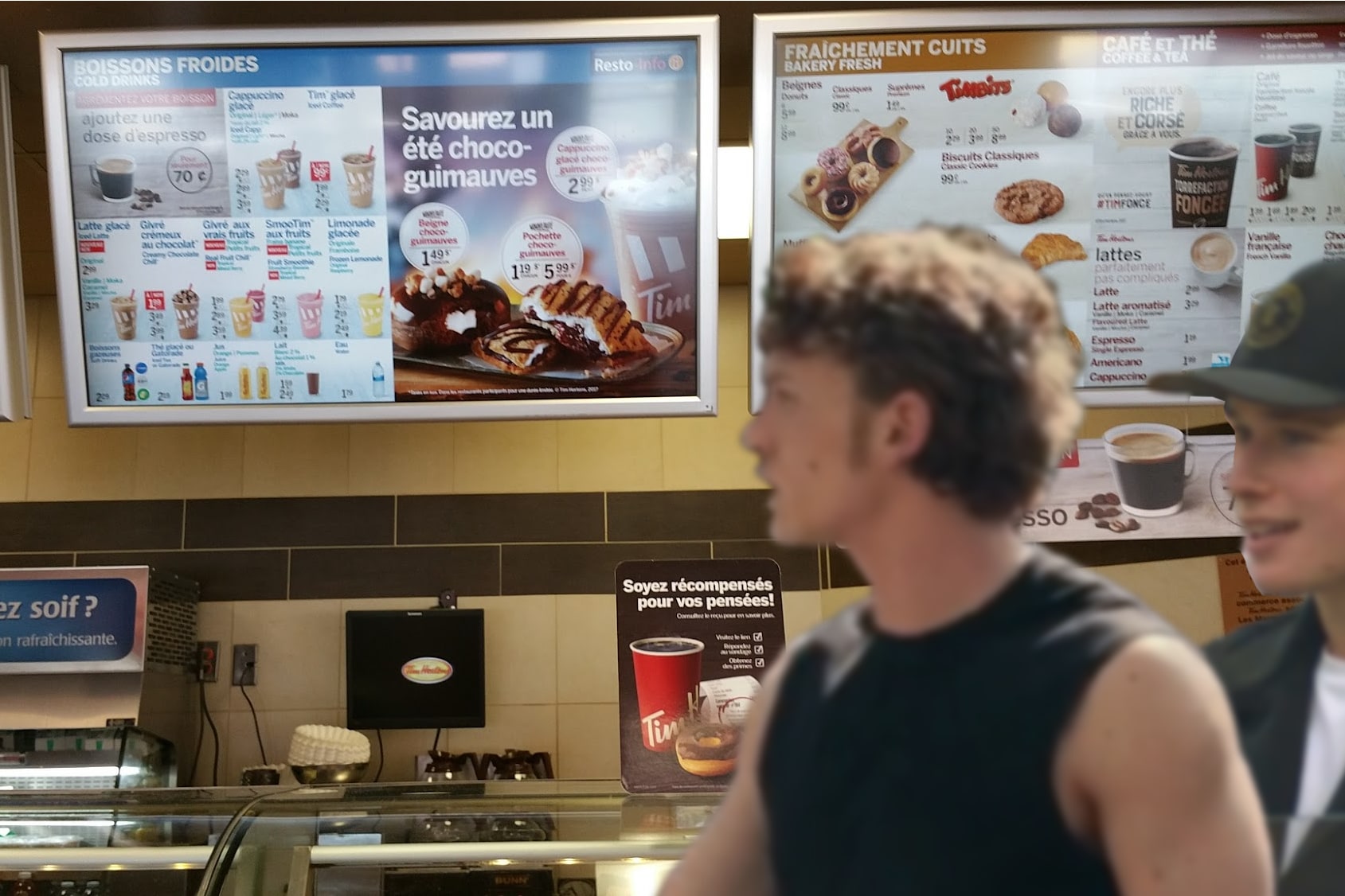 Blurry photo of Ilya Rozanov and Luca Haas inside a Tim Hortons
